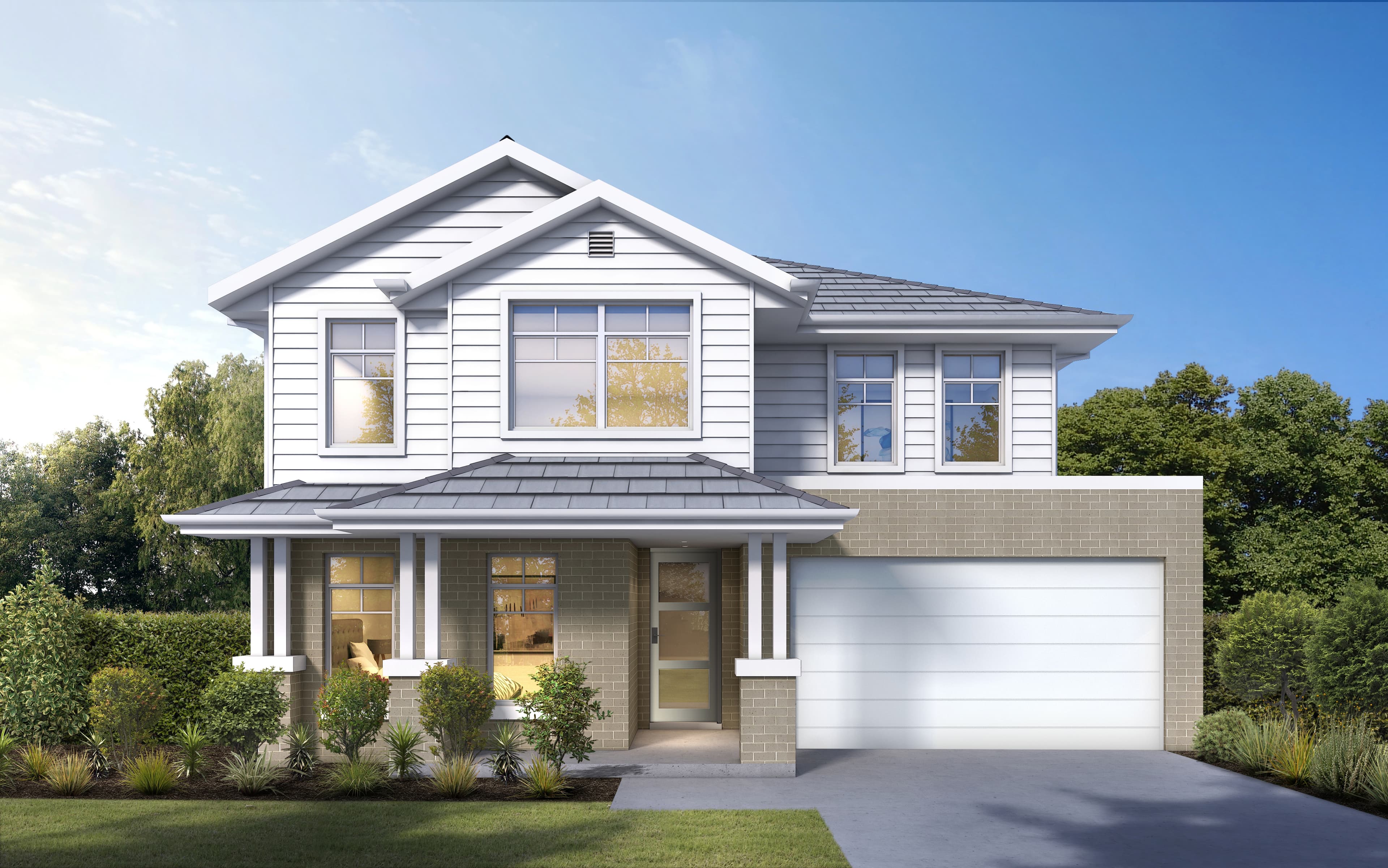 A modern two-story house with white siding, large windows, a covered front porch, a double garage, and landscaped shrubs and lawn in front, set against a backdrop of trees and a partly cloudy sky.