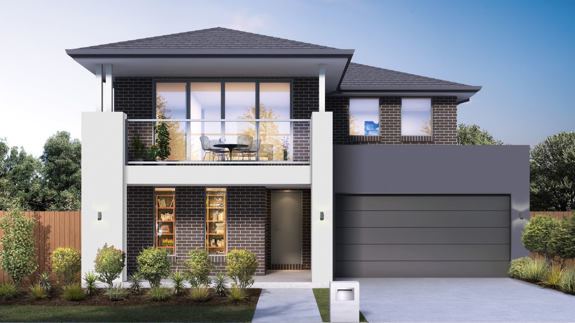 A modern two-story house with dark brick exterior, large windows, a balcony with outdoor furniture, a double garage, and landscaped front yard with shrubs and a mailbox.