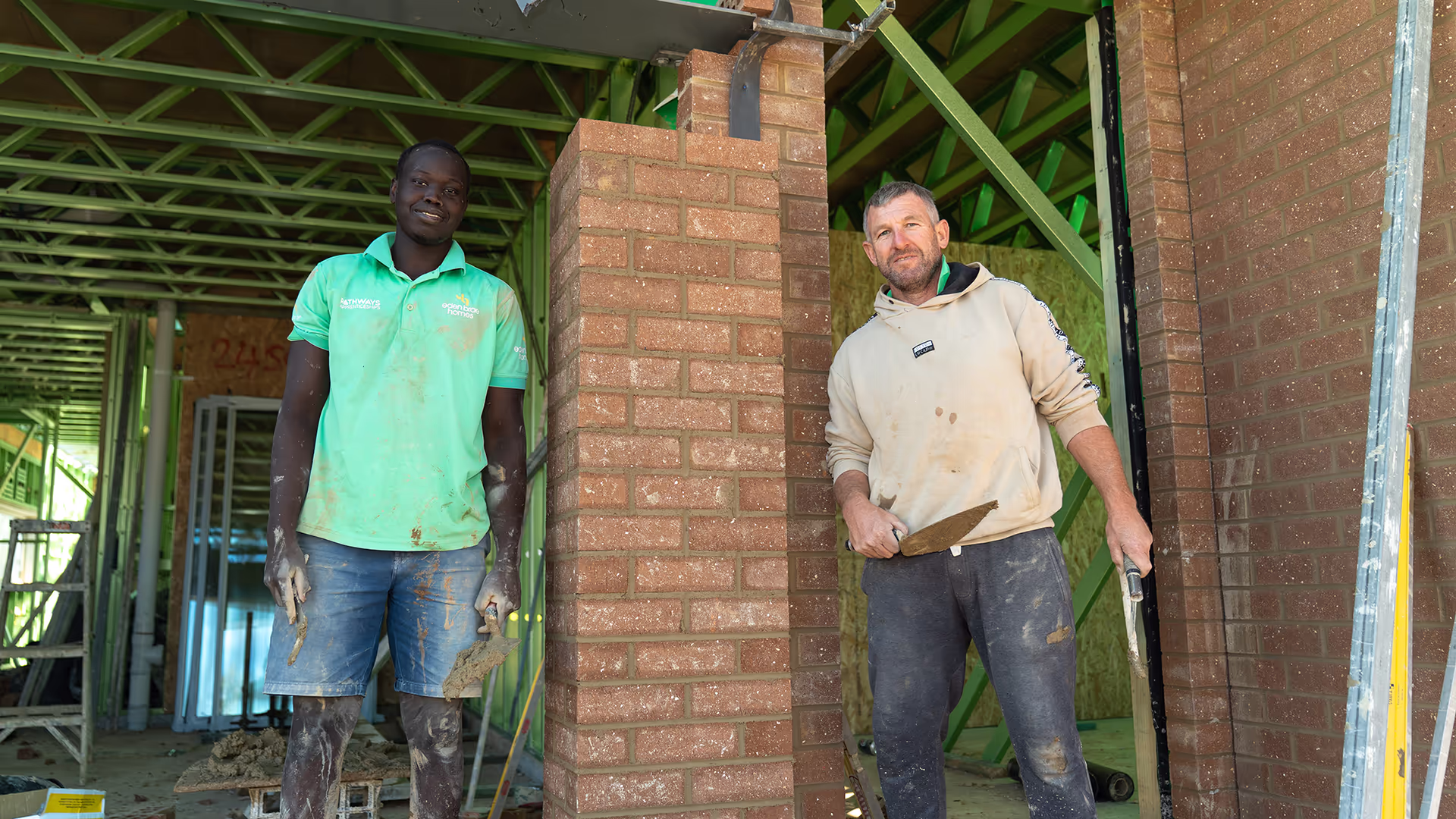 Apprentice bricklayers smiling