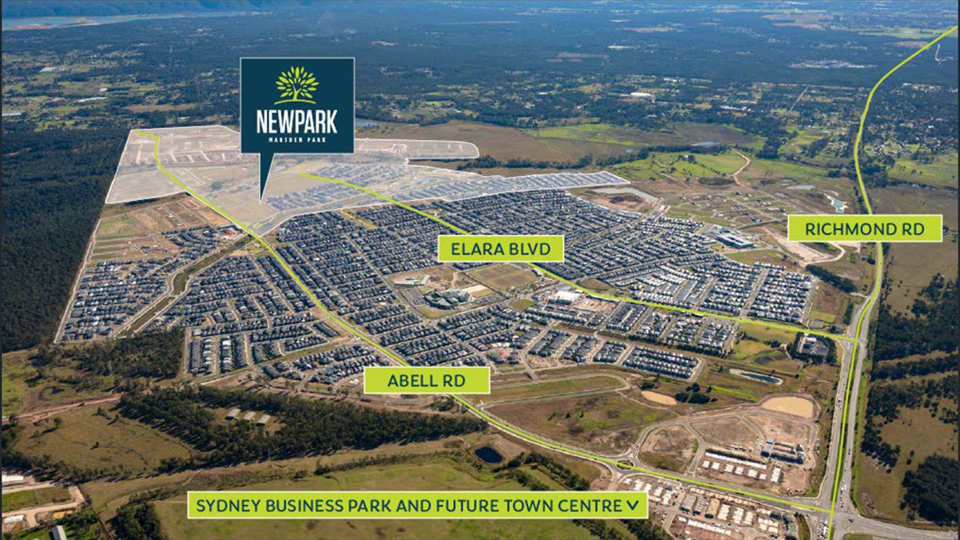 Aerial view of a suburban area labeled Newpark Marsden Park, showing residential neighborhoods, roads labeled Elara Blvd, Abell Rd, and Richmond Rd, with highlighted areas for Sydney Business Park and future town center.