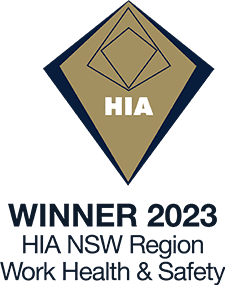 Award badge with a geometric diamond design and the text HIA in the center. Below, it reads: WINNER 2023 HIA NSW Region Work Health & Safety.