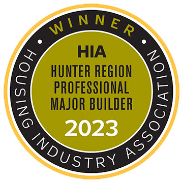 A circular badge reading WINNER HIA Hunter Region Professional Major Builder 2023 with Housing Industry Association written around the edge. The center is olive green with black and white text and border.
