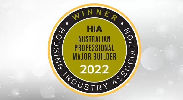 Circular badge reading “Winner HIA Australian Professional Major Builder 2022” with “Housing Industry Association” written around the edge; background is light gray with soft, blurred circles.