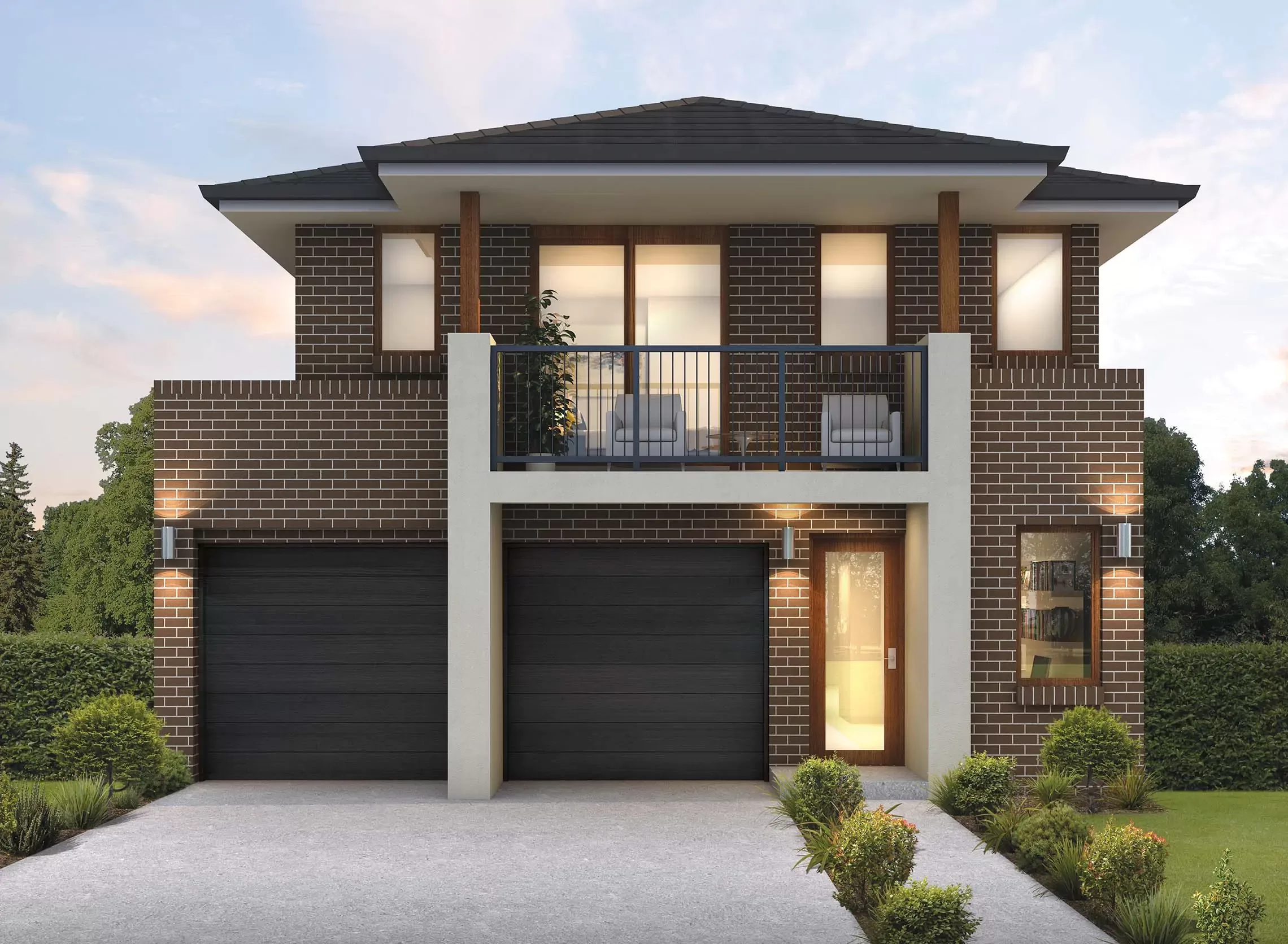 Modern two-story brick house with large windows, a balcony, two black garage doors, and a glass front door, surrounded by green shrubs and a well-kept garden.